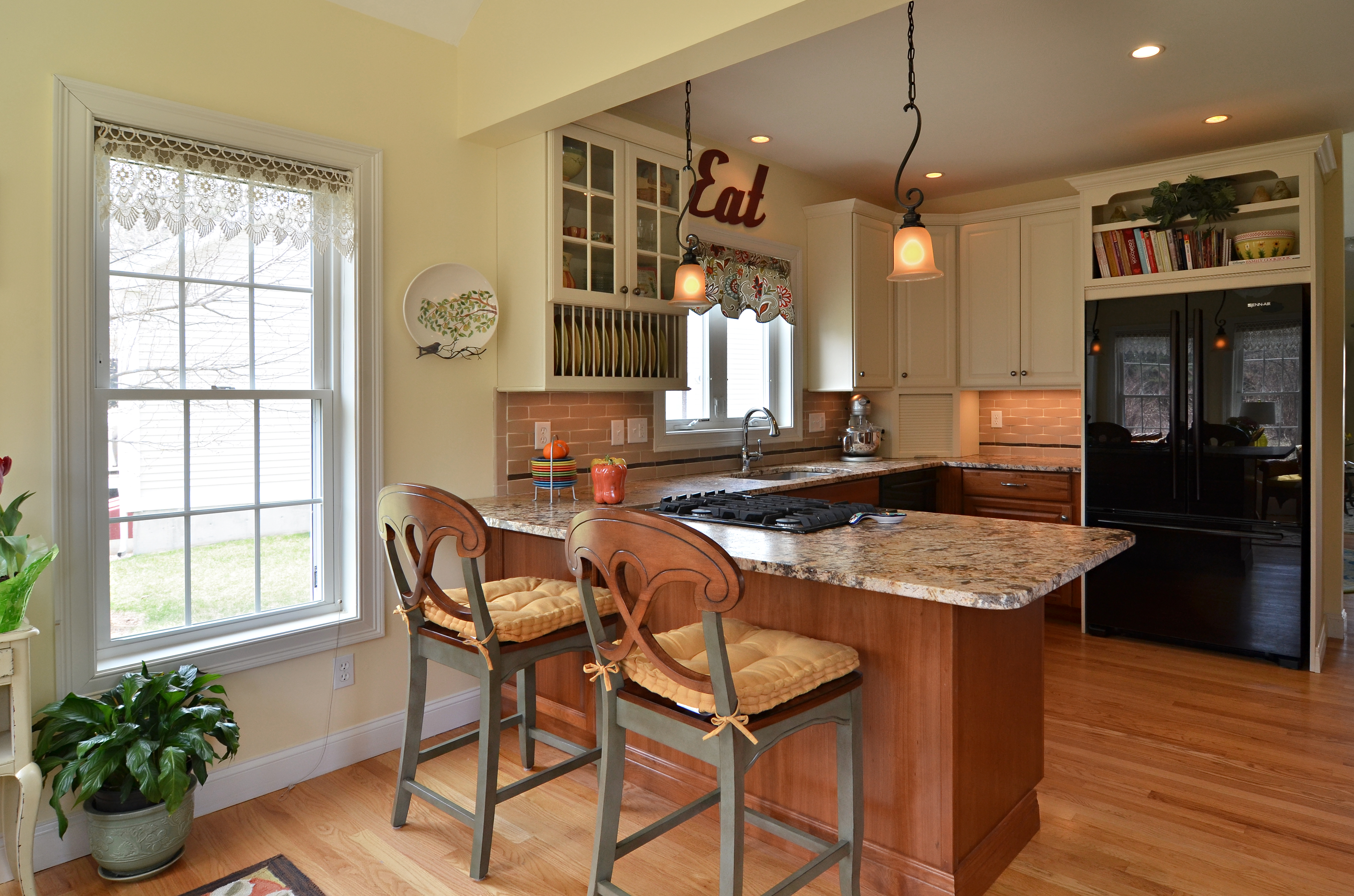 Combine small kitchen and sun room to create a spacious entertaining